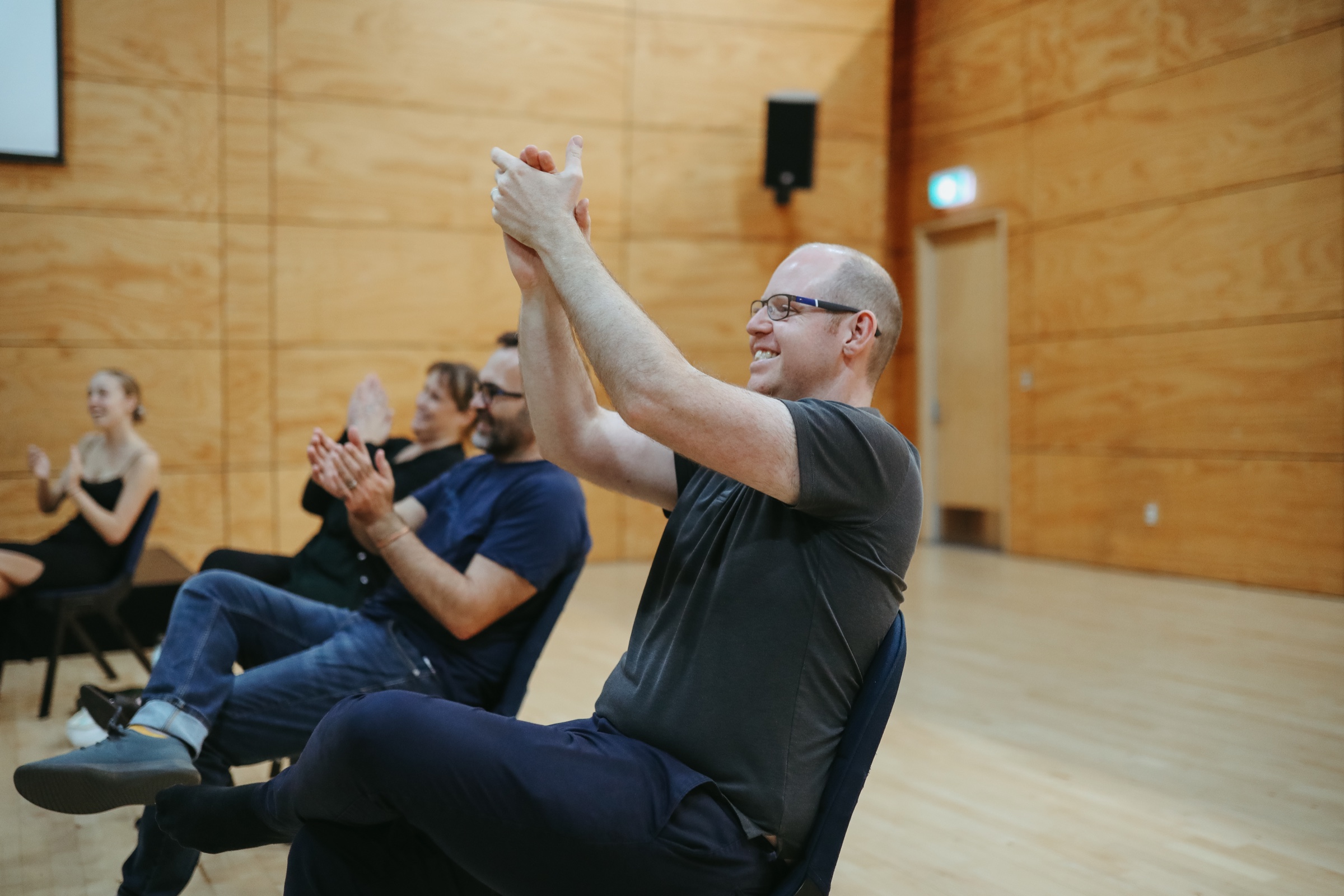 Scot Hall applauding a musical theatre singer during a workshop