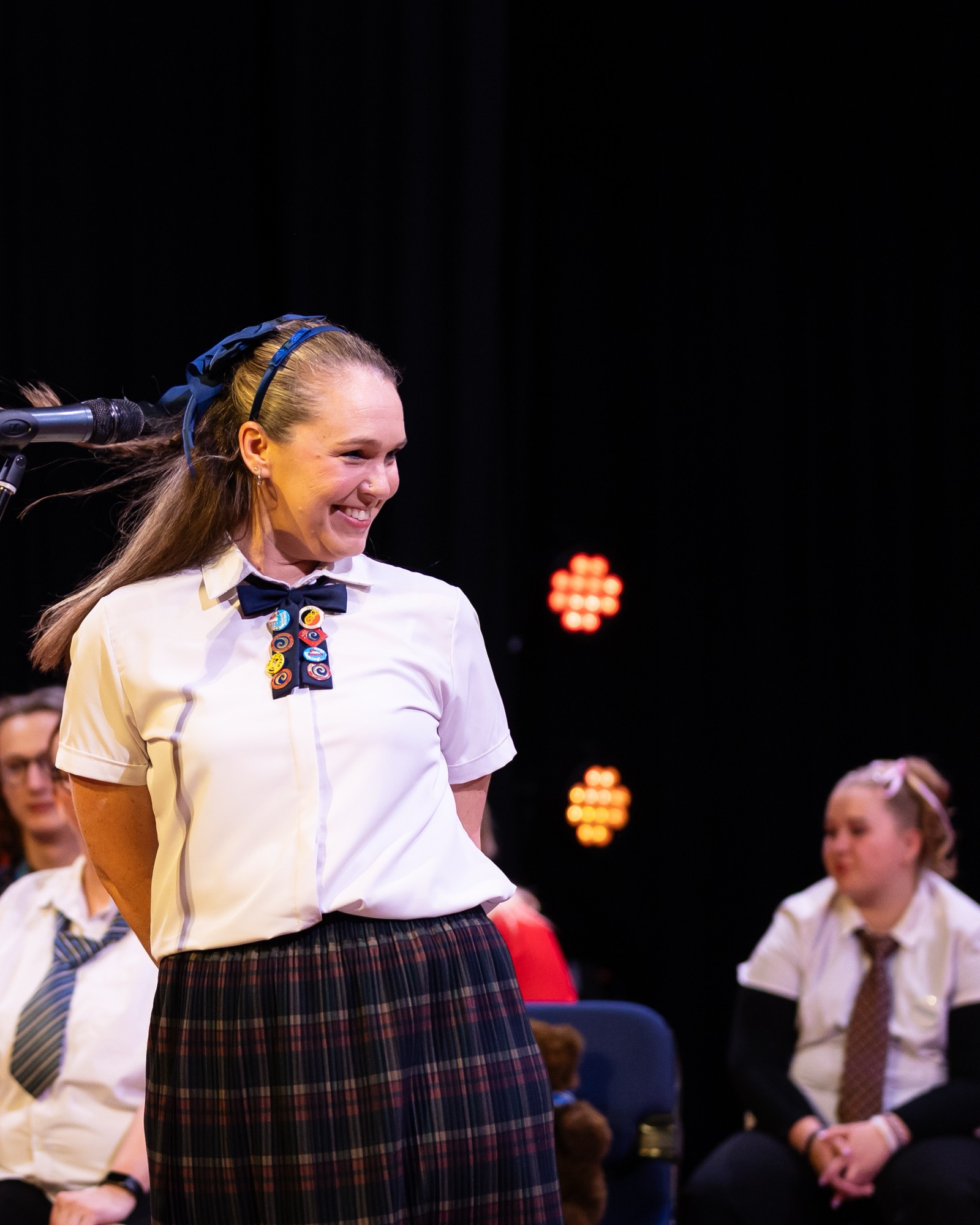 Nyssa Johansen performing onstage at a musical theatre showcase