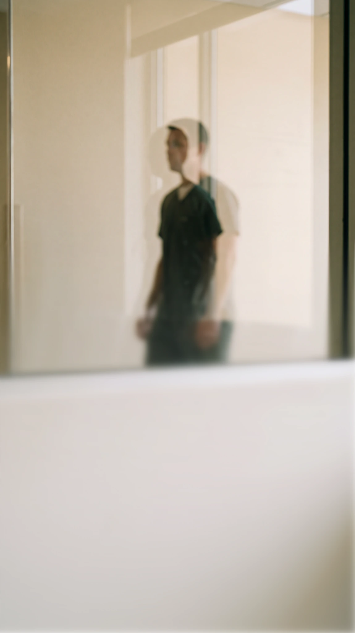 Blurred reflection of a person in a mirror