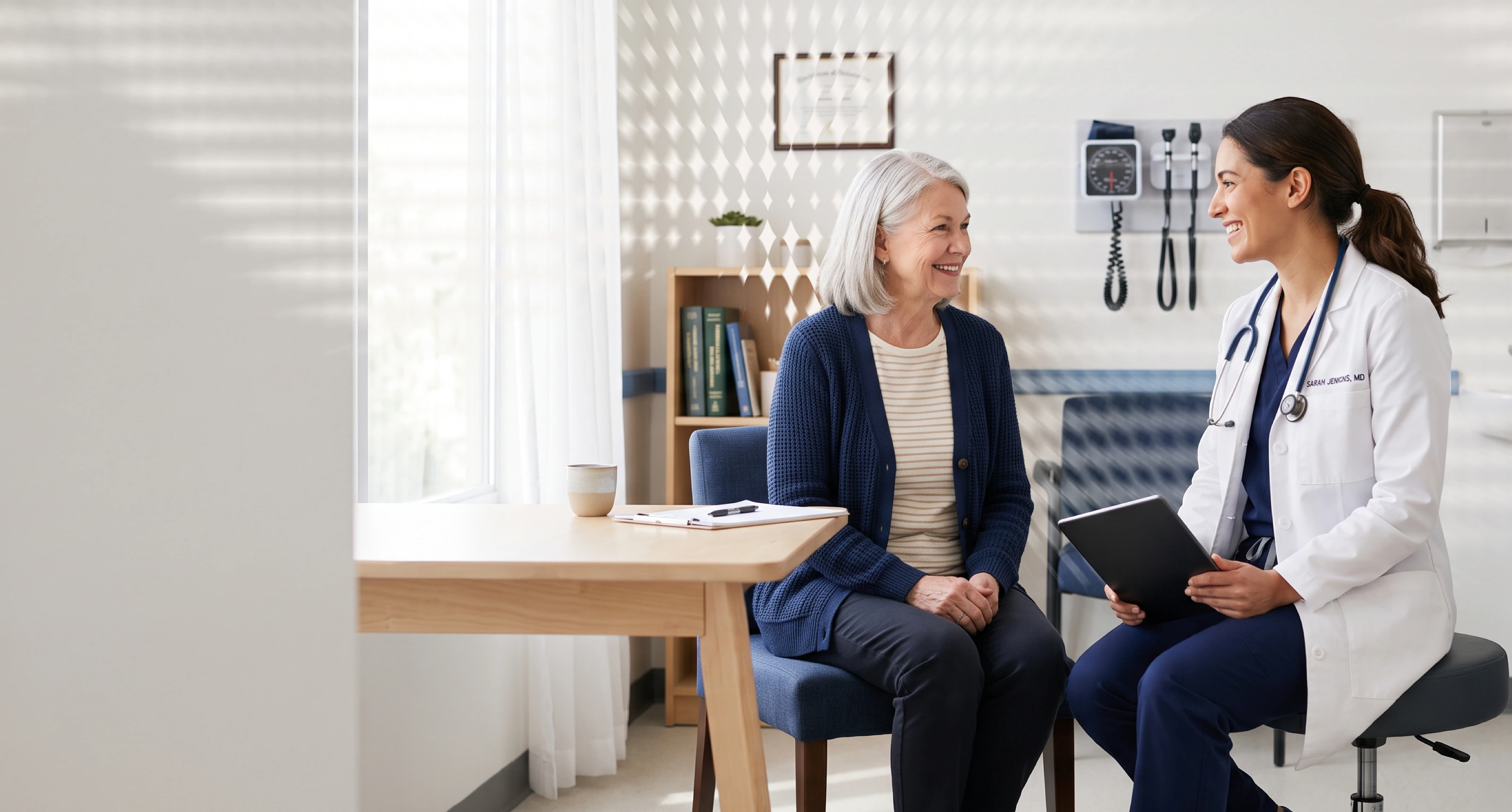 Doctor and patient in a consultation room, both smiling and engaged in conversation