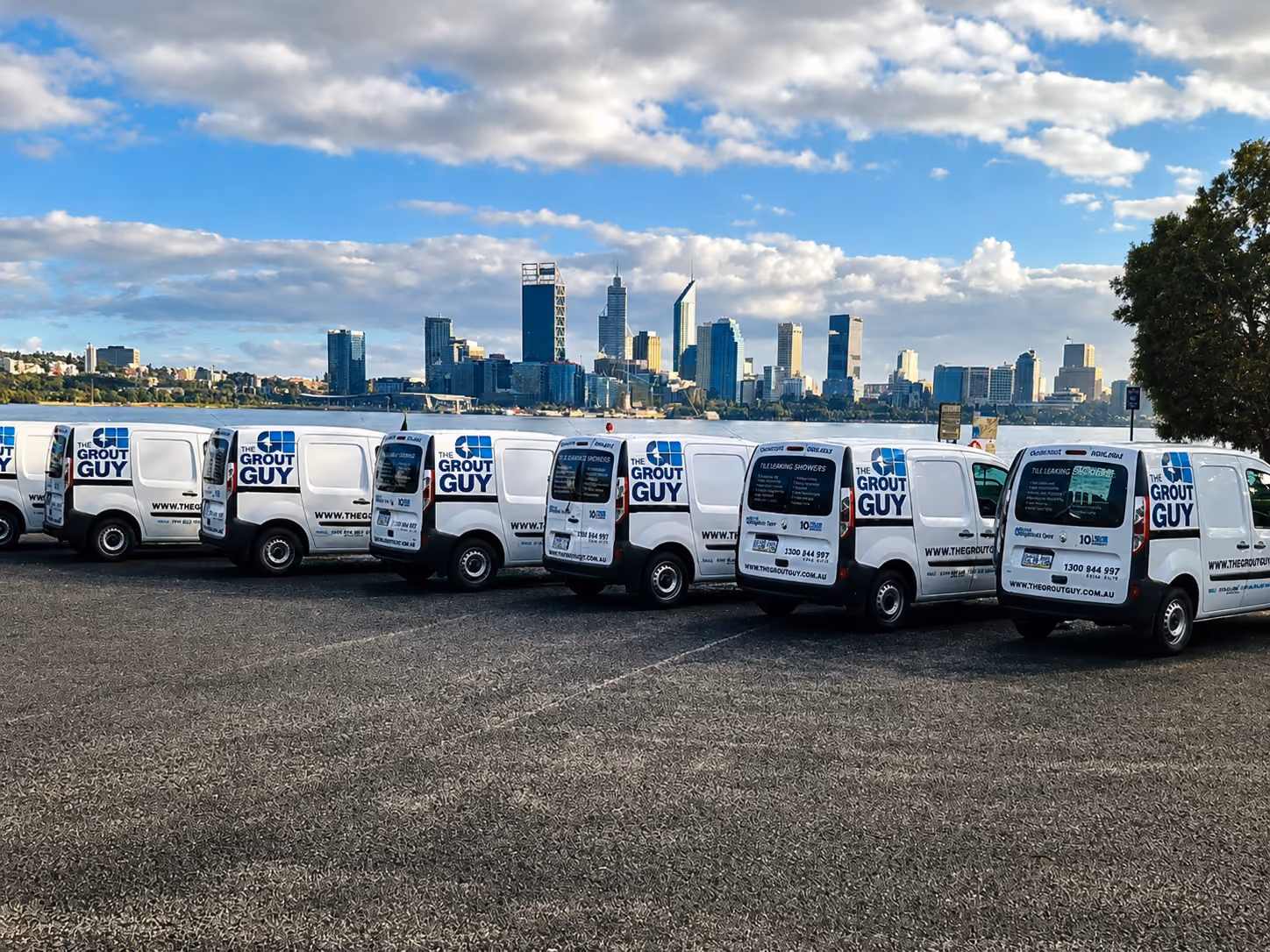 The Grout Guy branded service vehicle fleet.