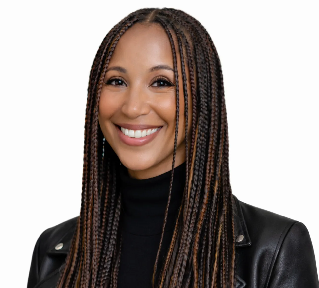 Smiling woman with long brown box braids wearing a black turtleneck and a black leather jacket against a white background.