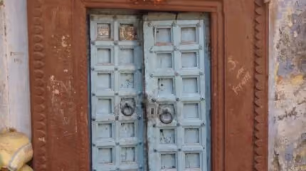 An old blue wooden door representing Northshore's missionaries in South Asia.