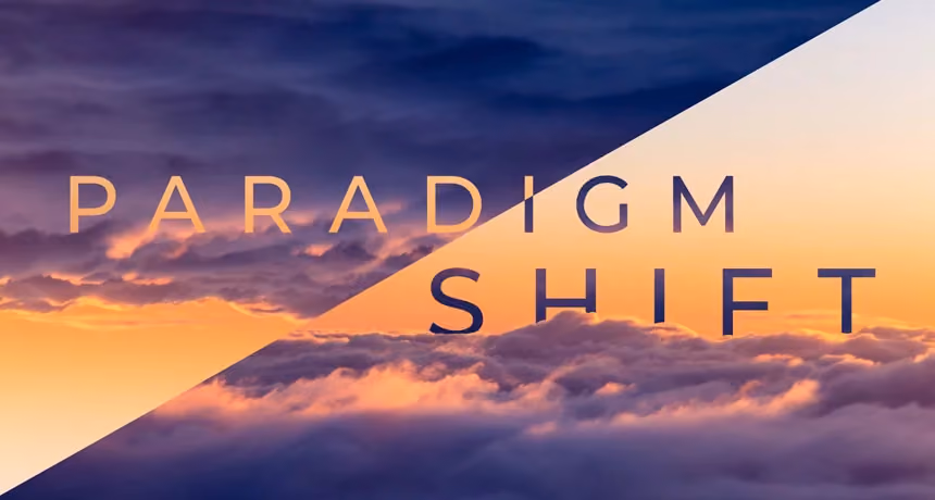 Text reading Paradigm Shift over a sky with clouds and sunset hues.