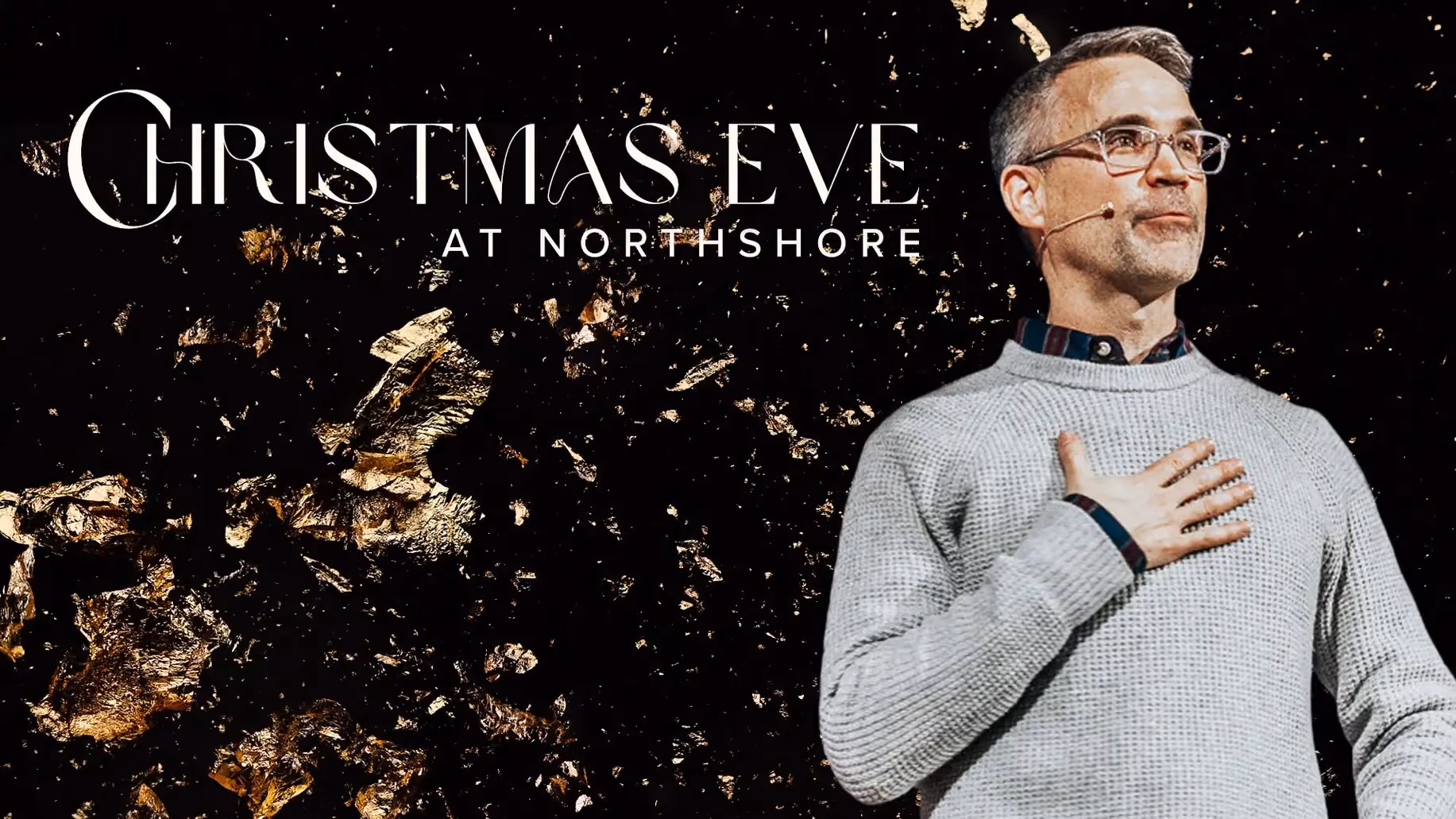Man in grey sweater with hand on chest, against dark background with gold confetti and text Christmas Eve at Northshore.