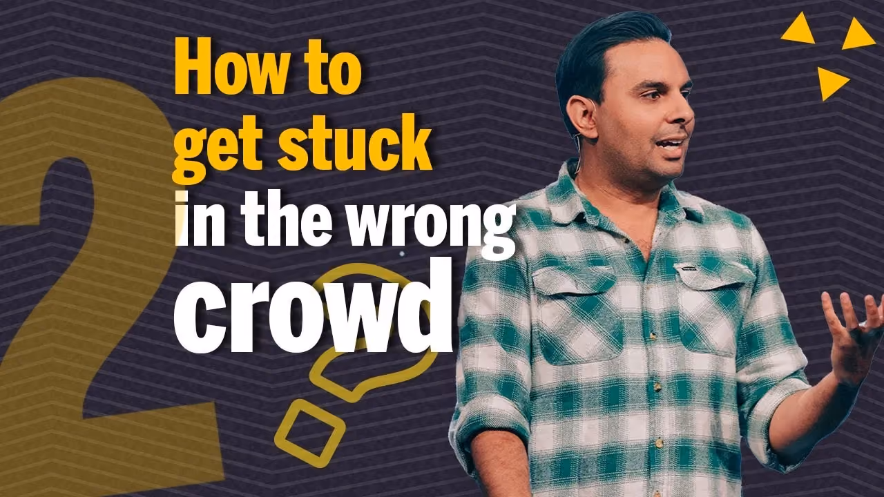 Man speaking on stage with text overlay about getting stuck in wrong crowd.