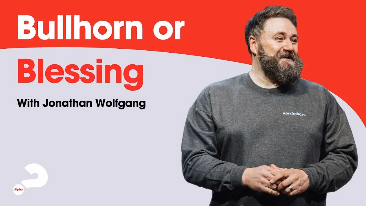 Bullhorn or Blessing with Jonathan Wolfgang, an Alpha talk, smiling in a grey sweatshirt.