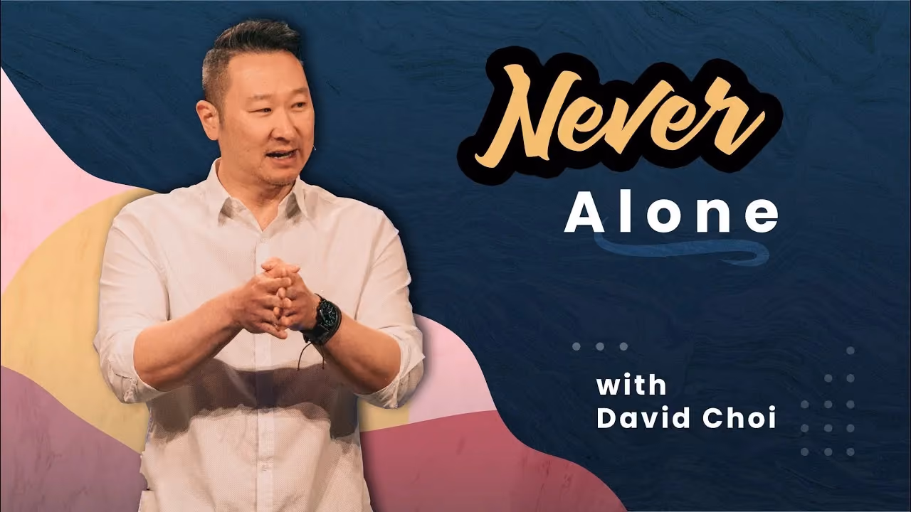 Never Alone with David Choi, hands clasped while speaking on a pastel-muraled stage.