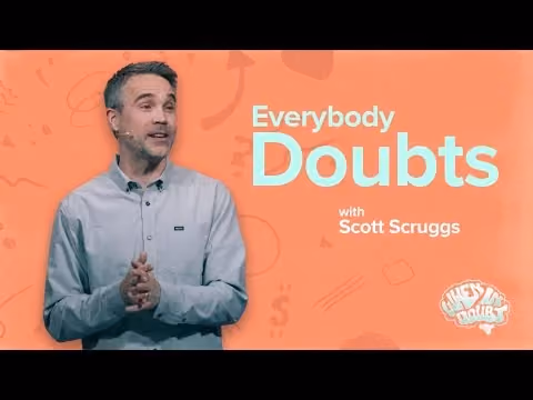 Everybody Doubts with Scott Scruggs, speaking in a light jacket against a coral background.