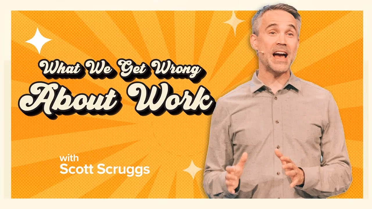 What We Get Wrong About Work with Scott Scruggs, both hands open mid-sentence on an orange sunburst.
