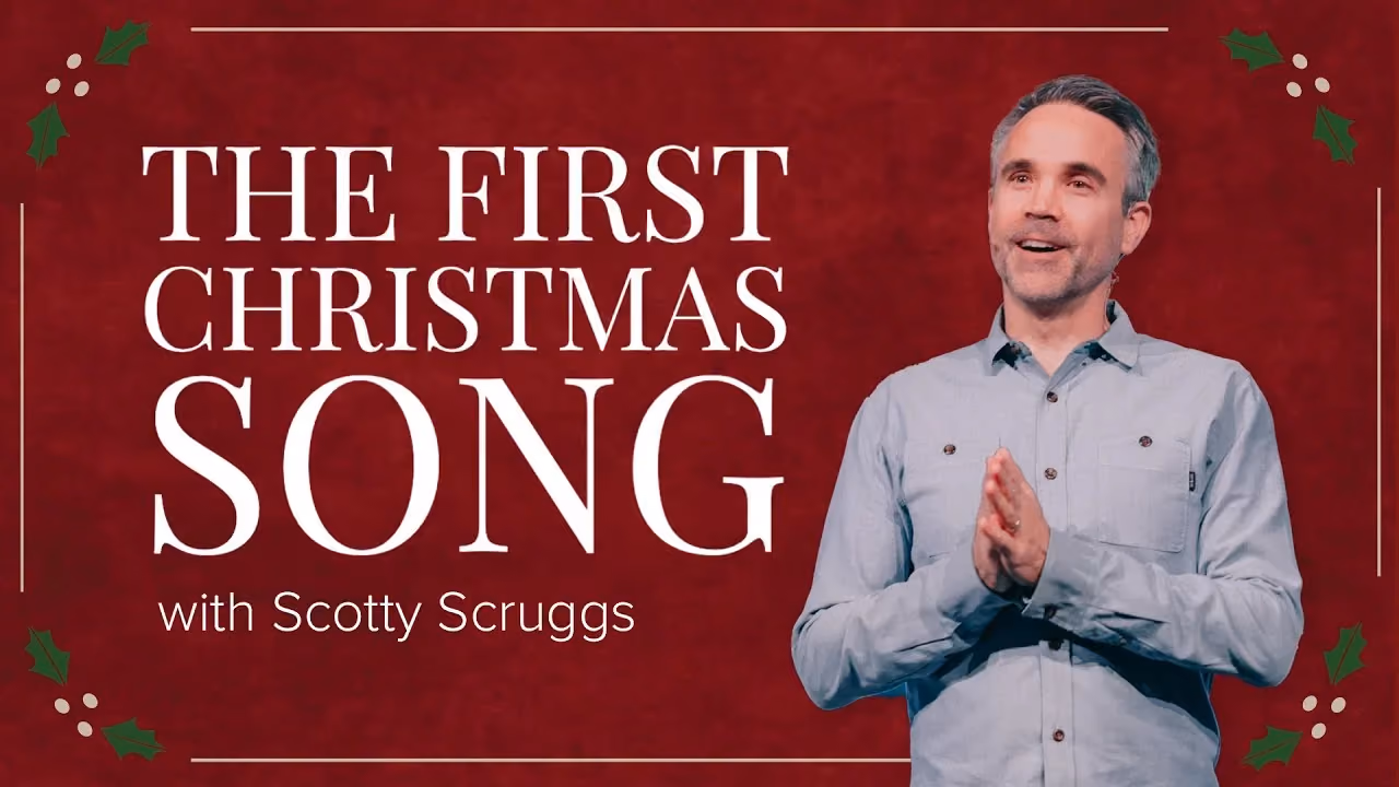 The First Christmas Song with Scotty Scruggs, hands pressed together on a red holly backdrop.