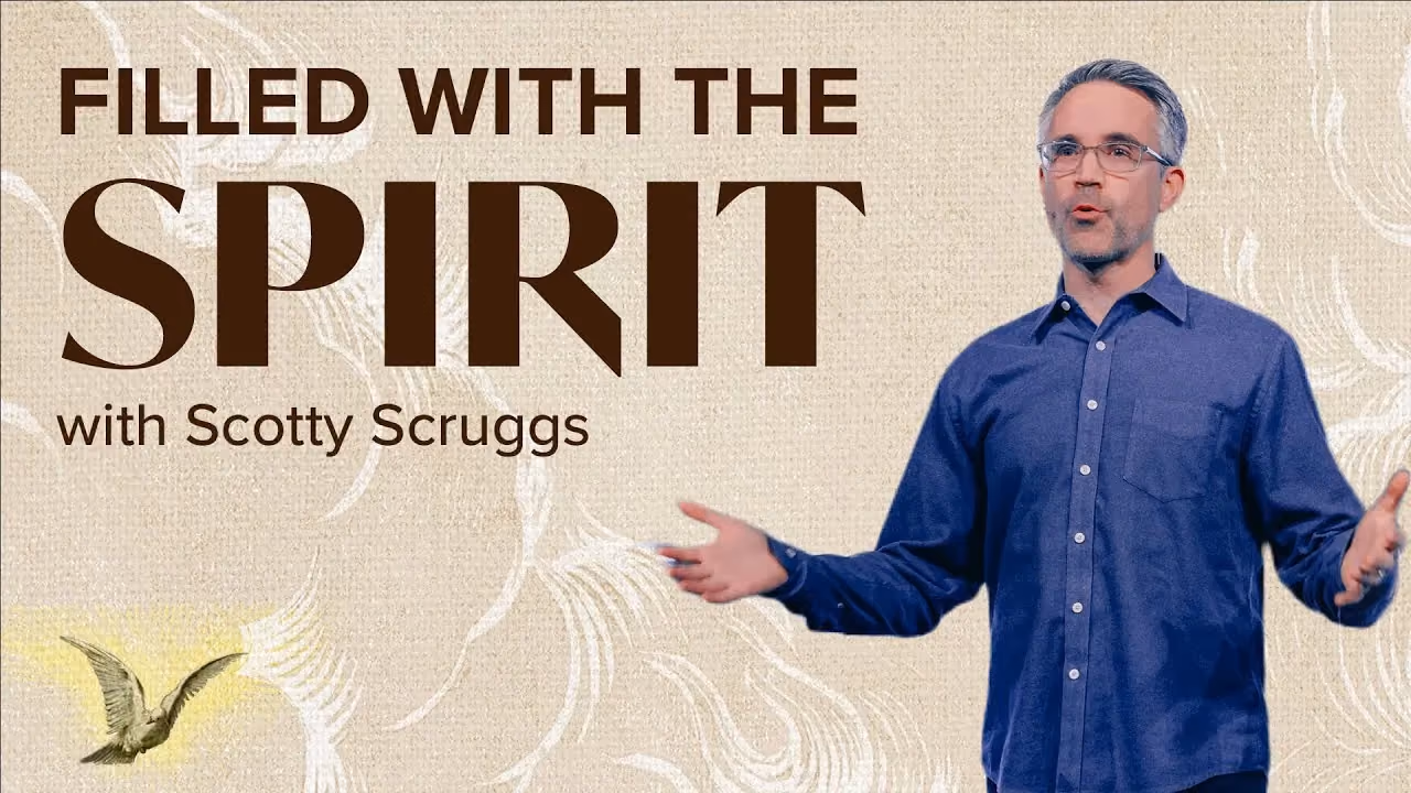 Filled with the Spirit with Scotty Scruggs, hands open while speaking beside a dove motif.