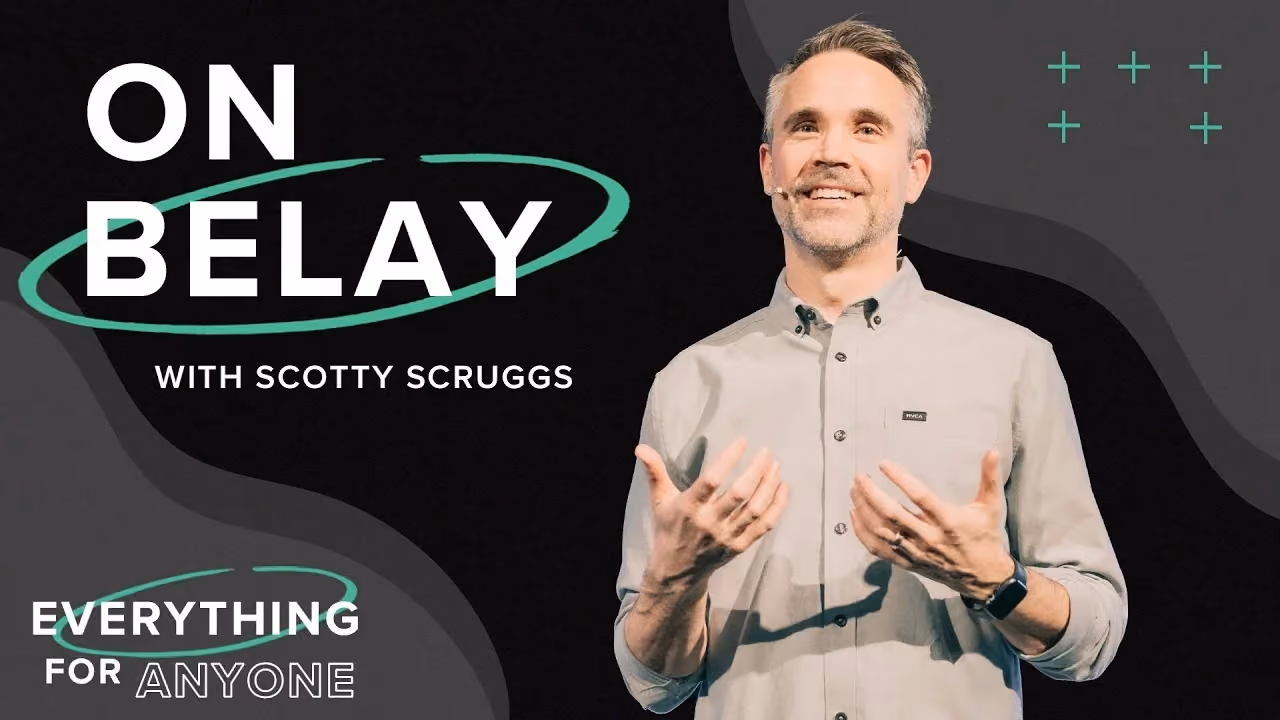 On Belay with Scotty Scruggs, both hands open while speaking, Everything for Anyone series.