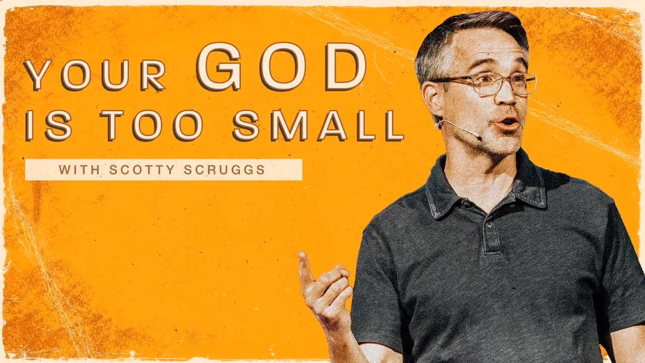 Your God is Too Small with Scotty Scruggs, index finger raised while speaking.