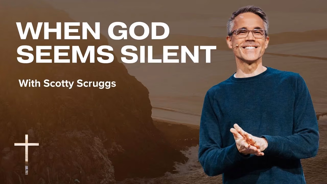 When God Seems Silent with Scotty Scruggs, hands open before a coastal cliff.