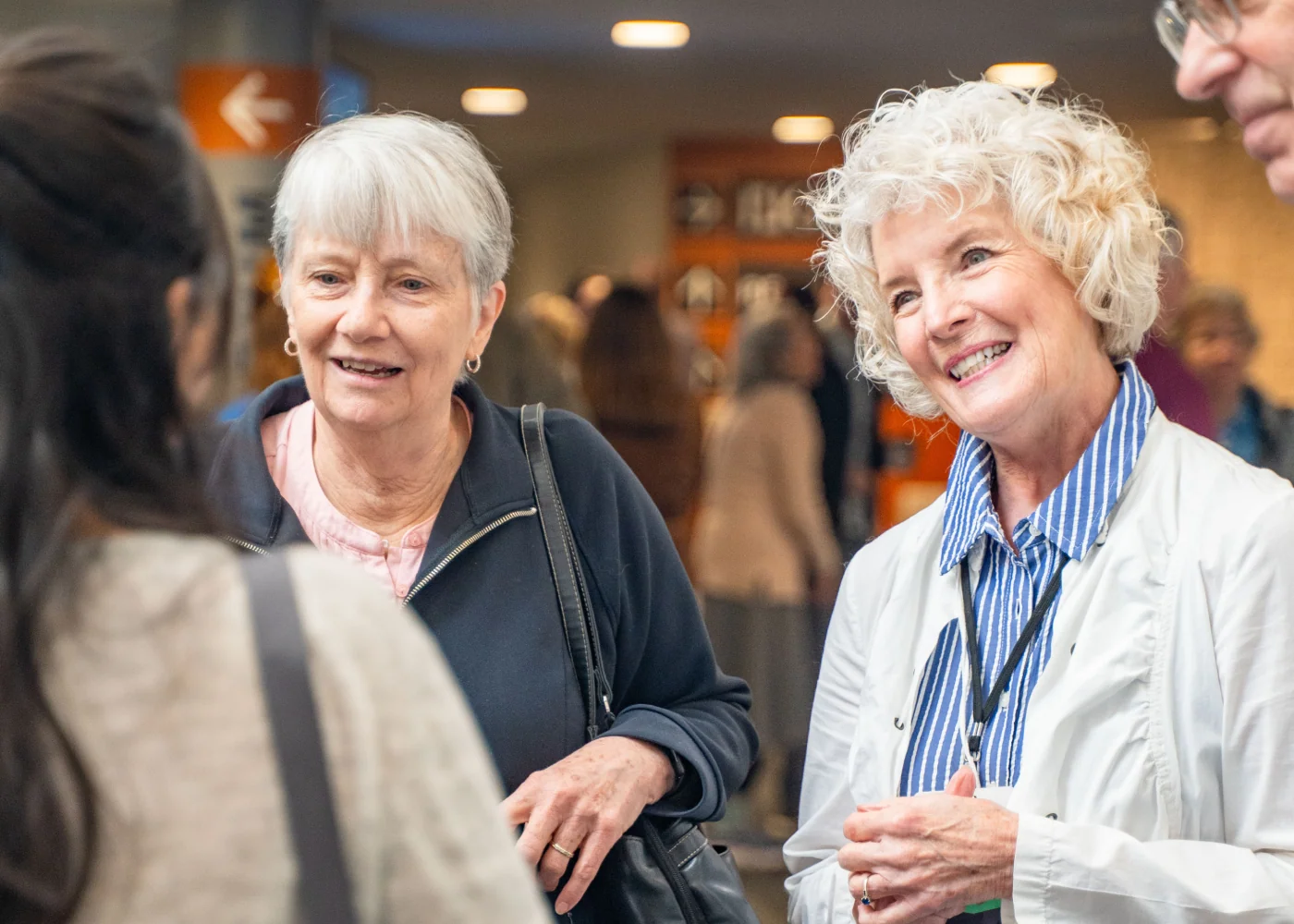 Women smiling together at a Northshore Church event.