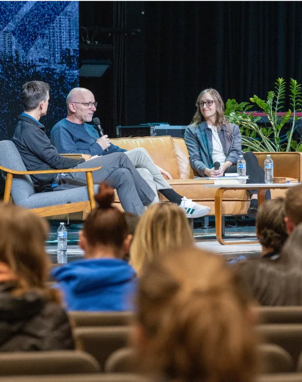 An audience watching a panel discussion at Northshore Church.