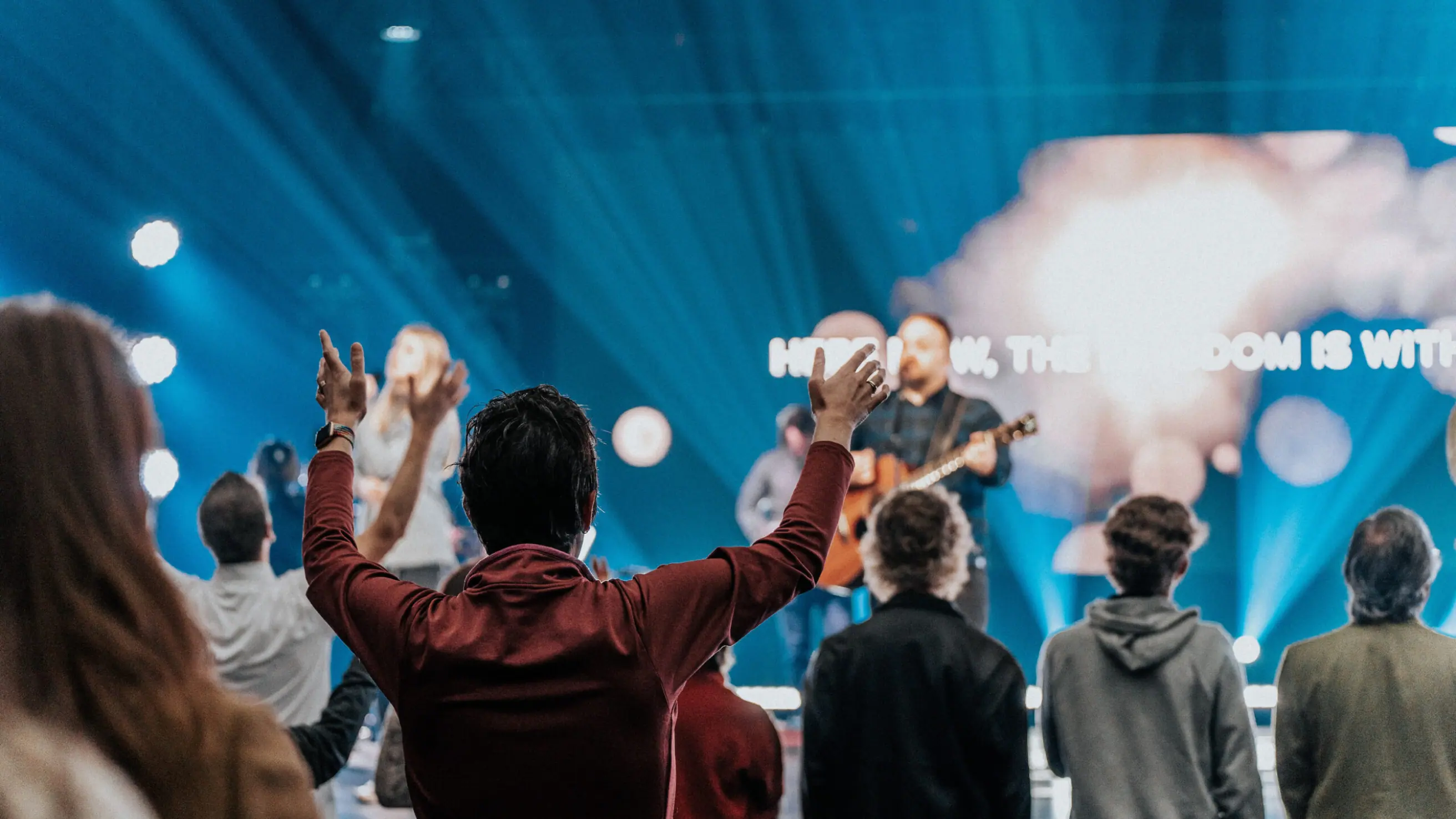 People worshiping together during a service at Northshore Church.