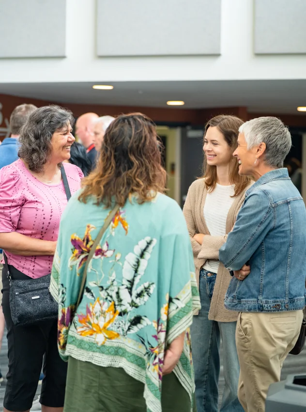 Women chatting together in a small group as part of Grow.