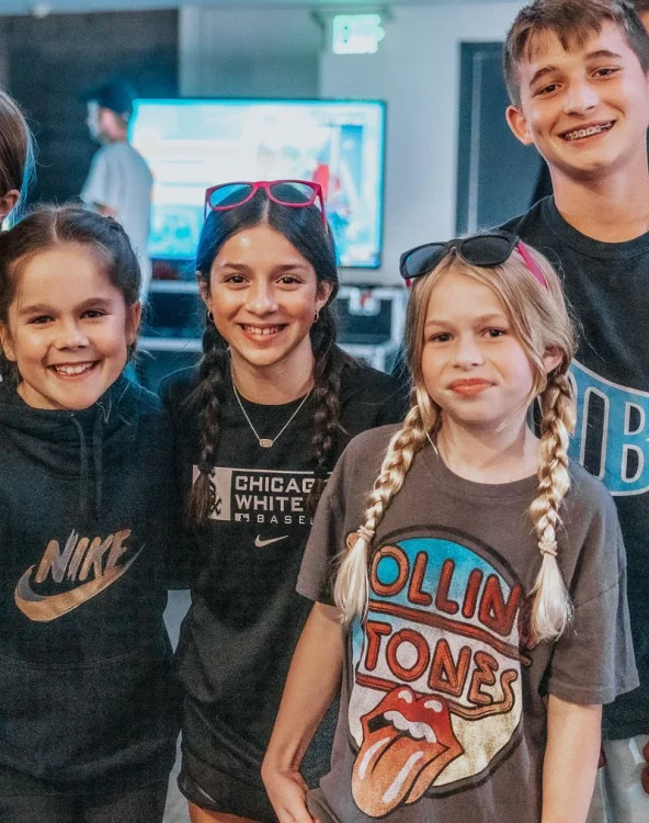 Students smiling together at an event.