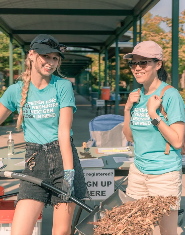 Two women volunteering together.