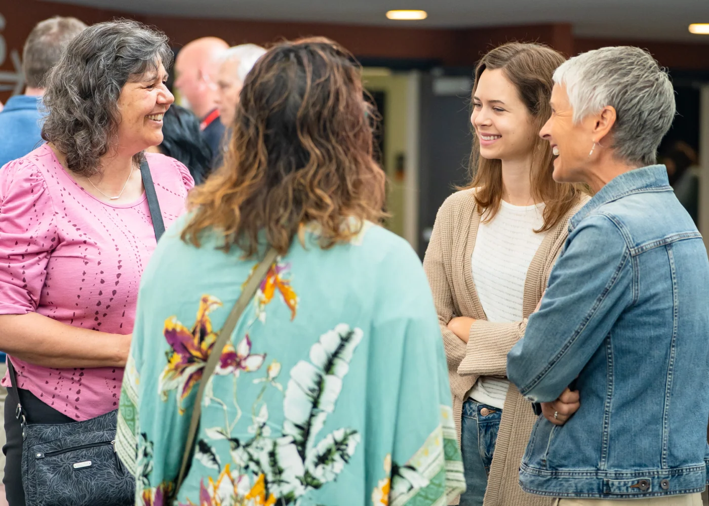 Women laughing together at a Northshore Church event.