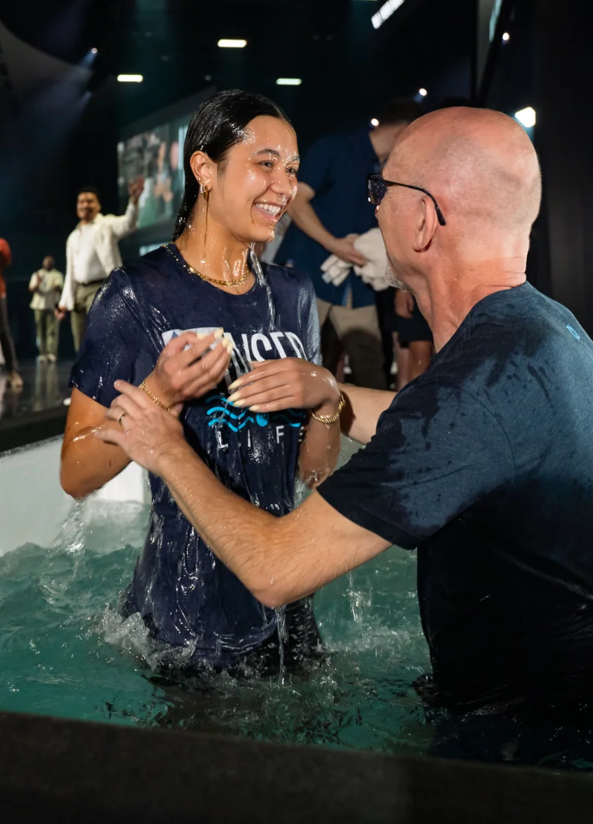 People celebrating during a water baptism at Northshore Church.