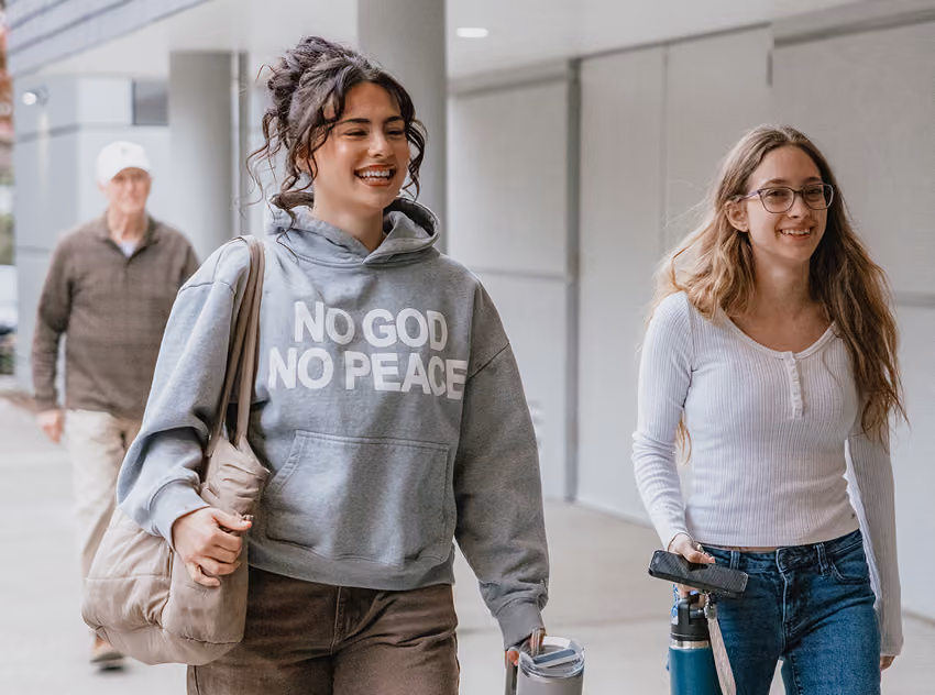 women walking smiling