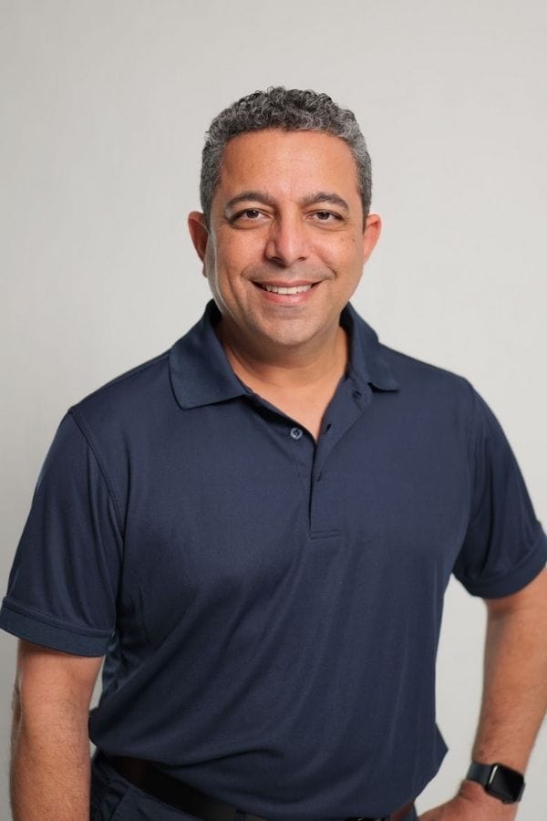 Dr Nader Malik in scrubs