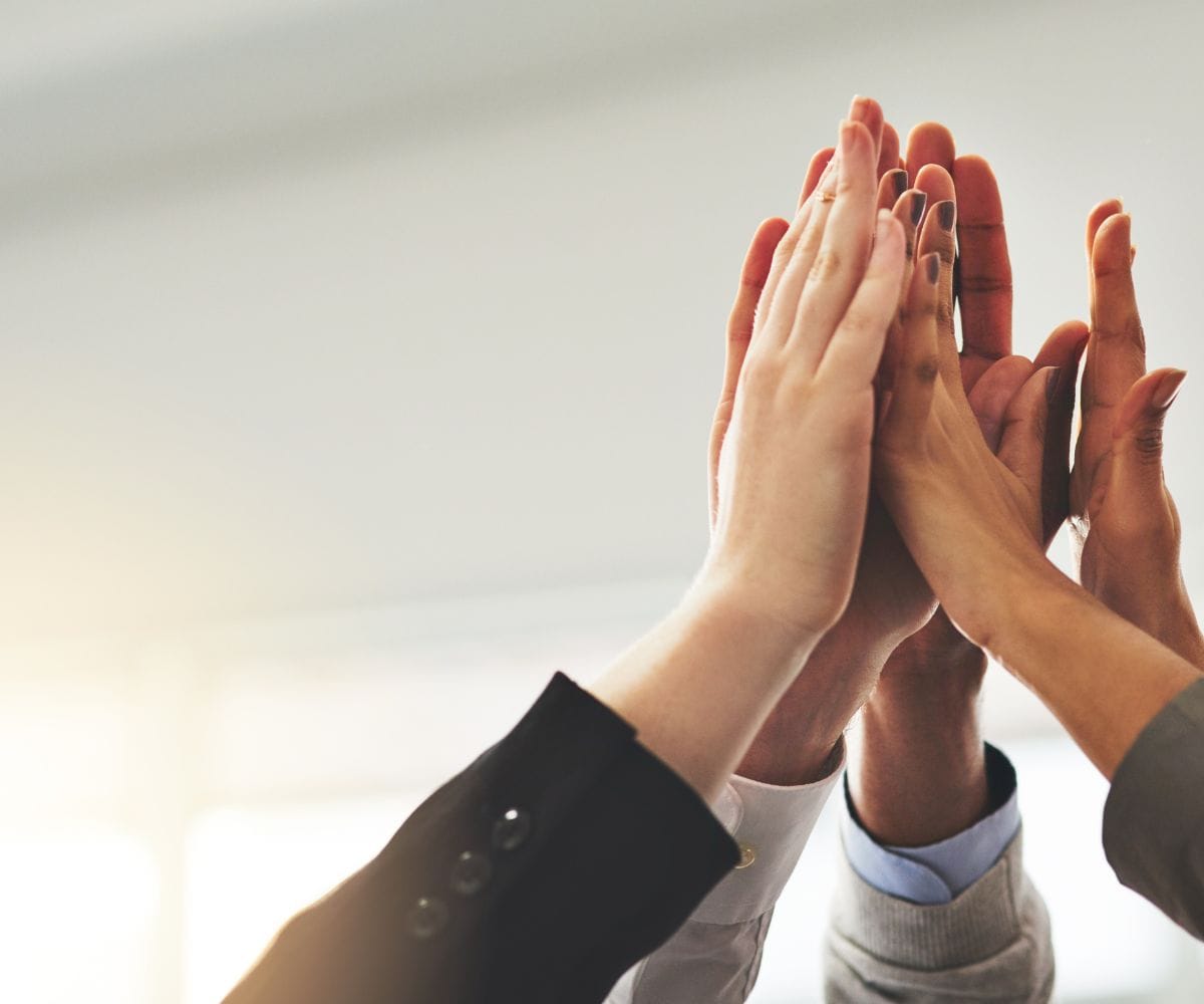 Hands celebrating a professional achievement