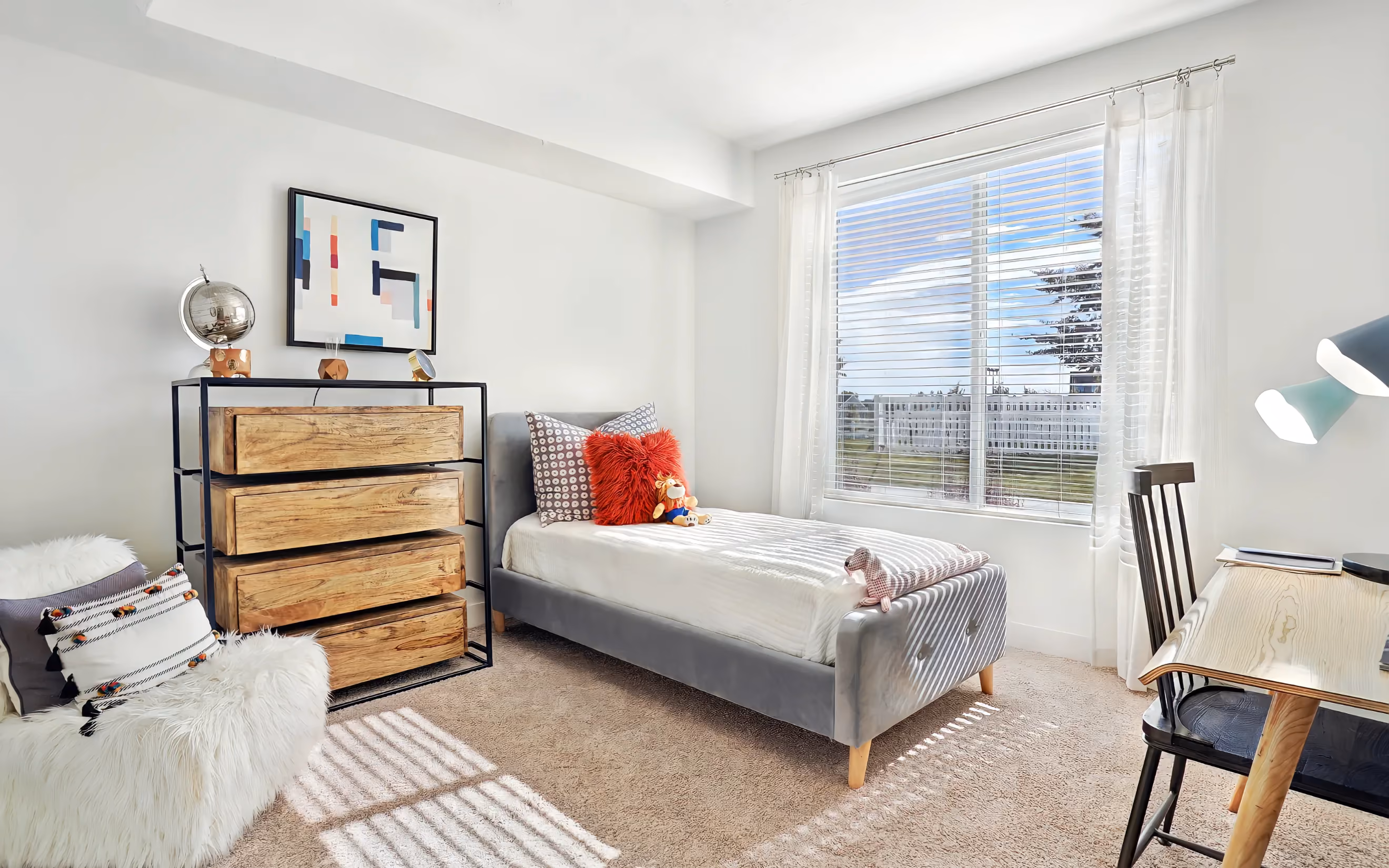 well lit Bedroom with twin size bed 