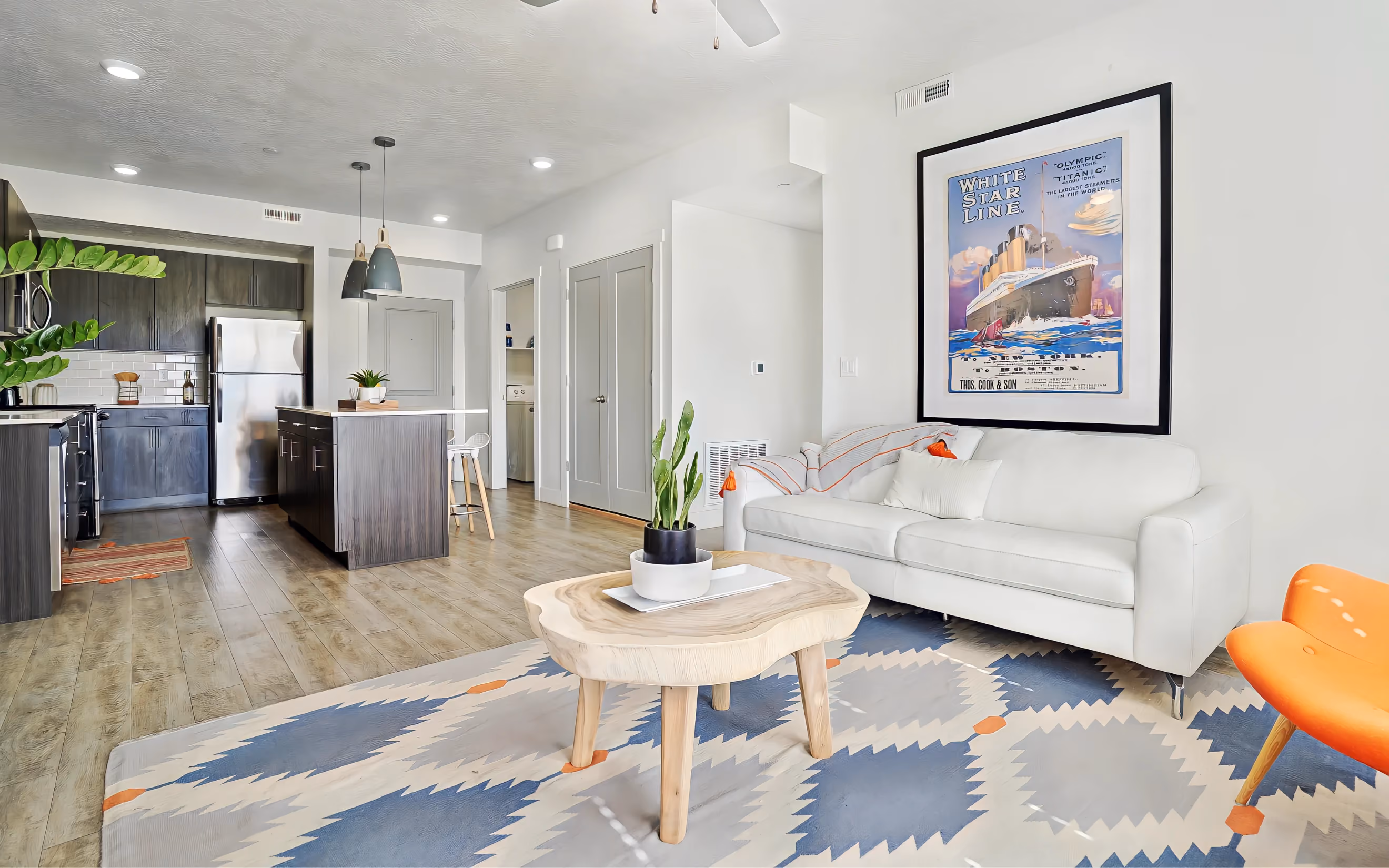 Living room with white couch and blue and white carpet