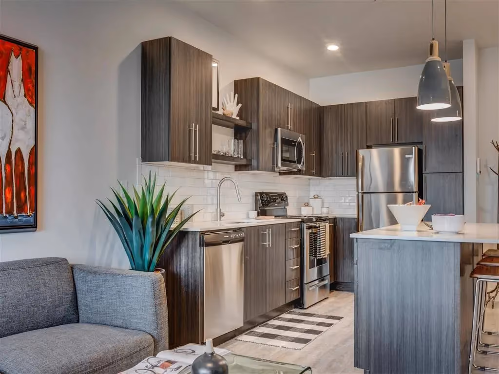 Kitchen withbrown cabinets and white tops