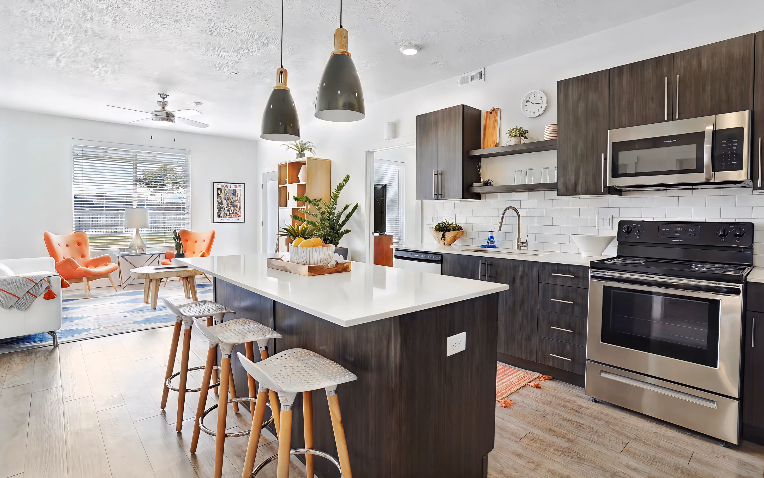 Kitchen with white countertops and brown cabinets