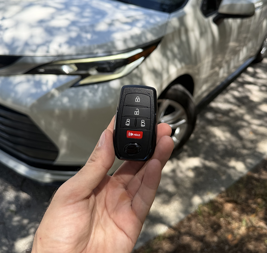 locksmith holding a new car key