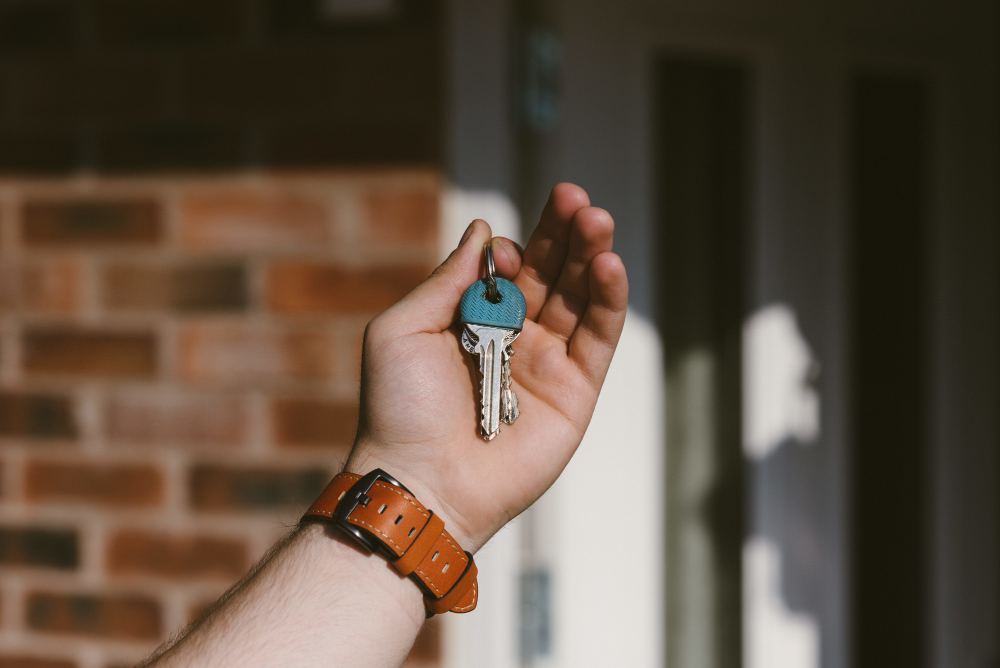 Closeup of a person hand holding keys with a blurred background