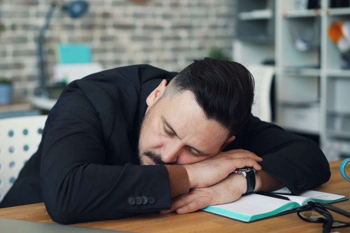 Fatigued healthcare professional showing signs of adrenal fatigue