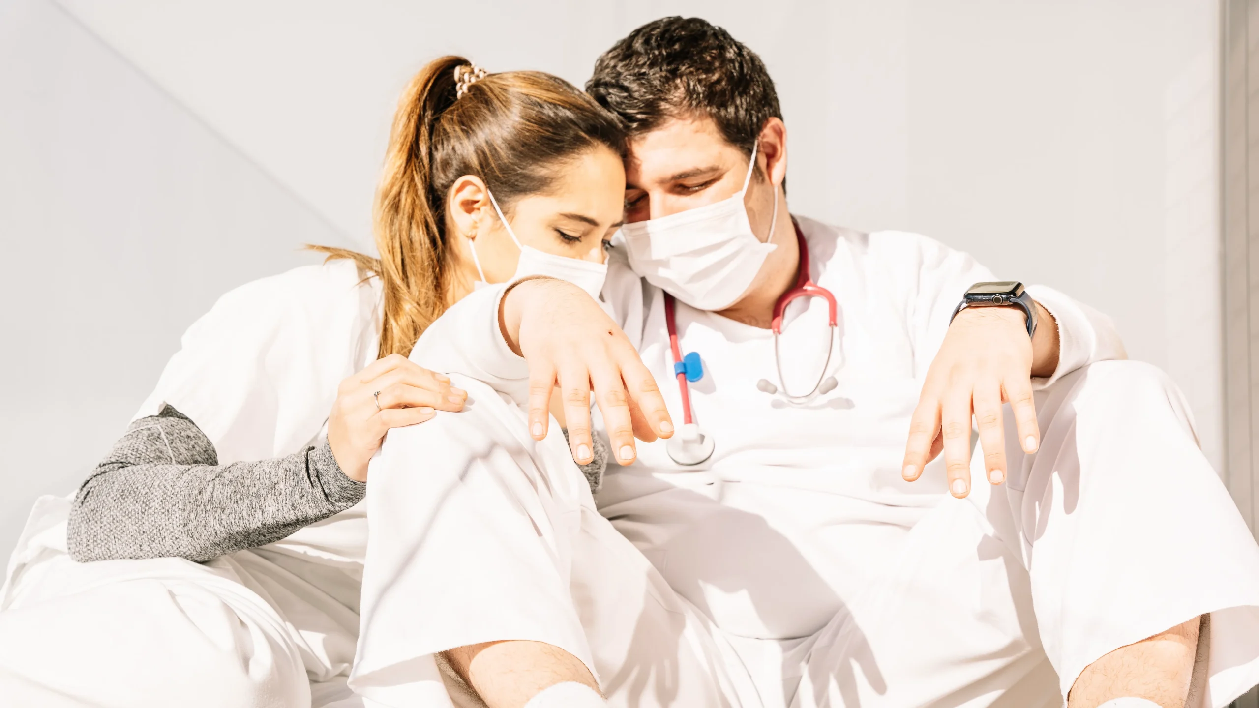 Exhausted dentist experiencing burnout symptoms in America