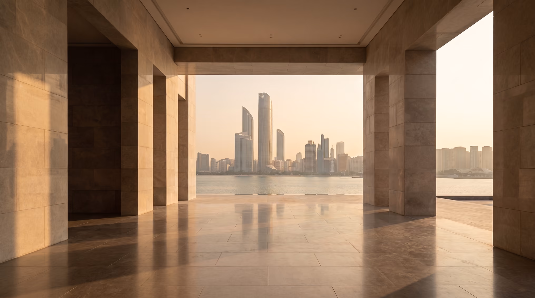 Colonnade framing the Abu Dhabi skyline across the water