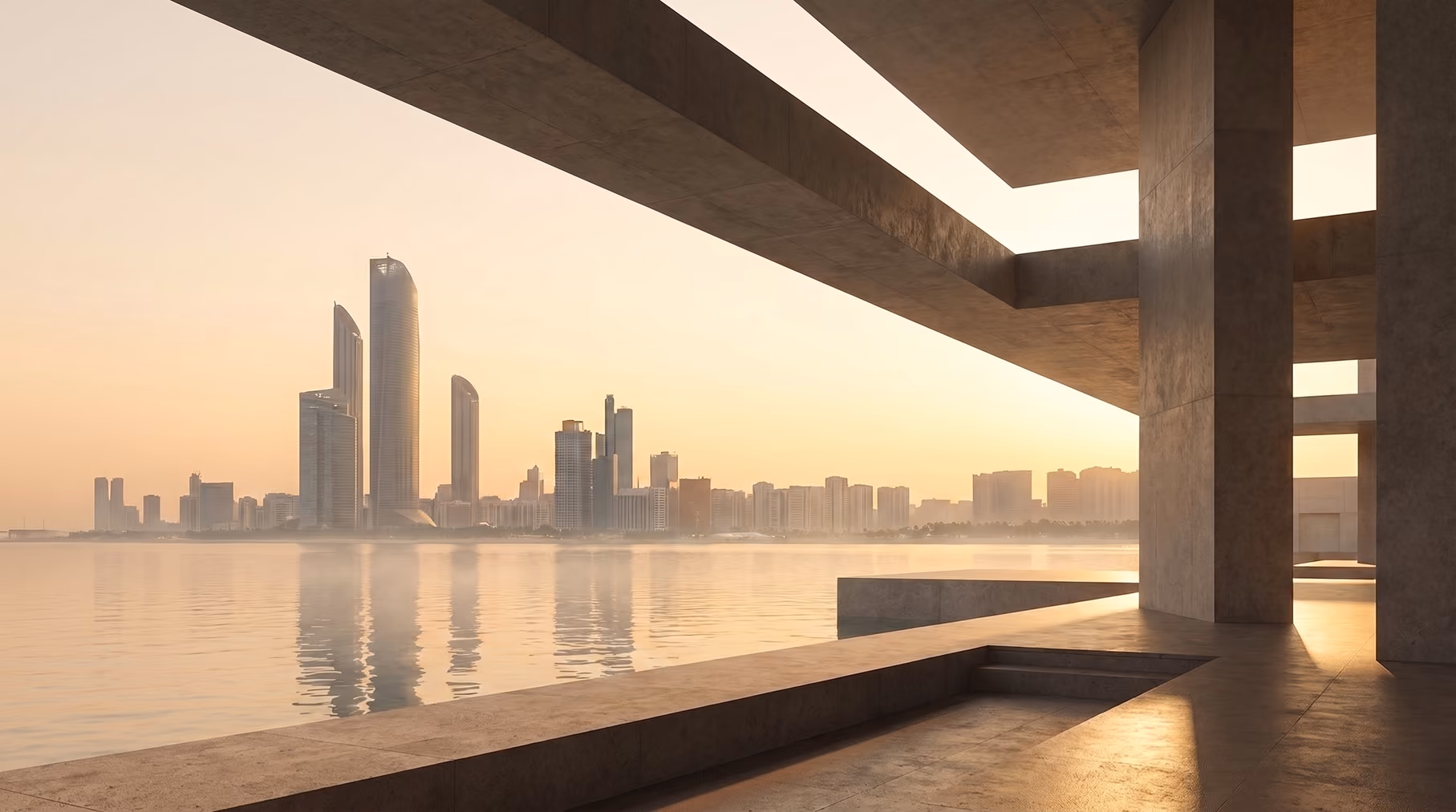 Modern landmarks across misty water at first light