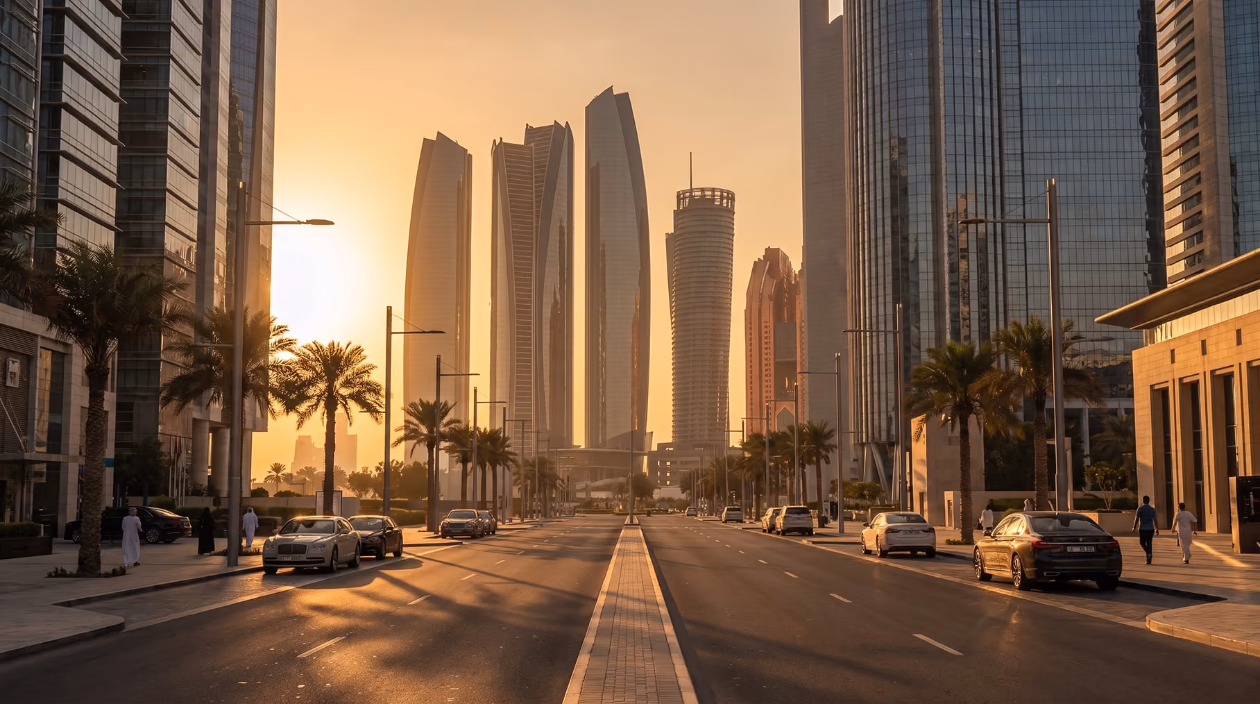 Illuminated towers lining a city avenue at night