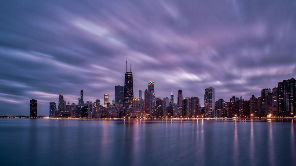 Chicago skyline across Lake Michigan at blue hour