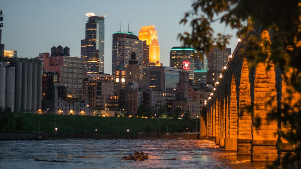 Stone Arch Bridge and the Minneapolis skyline at dusk