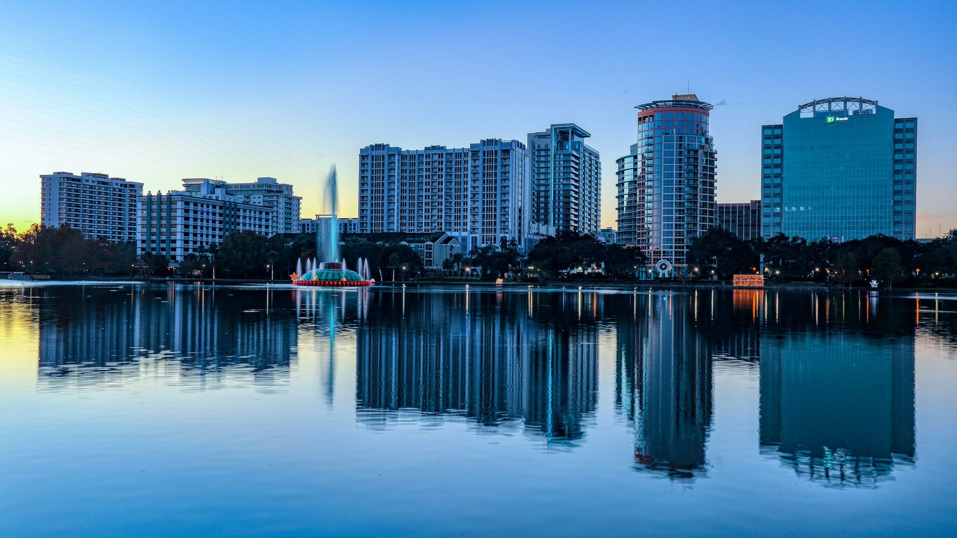 Downtown Orlando skyline reflected in Lake Eola at blue hour