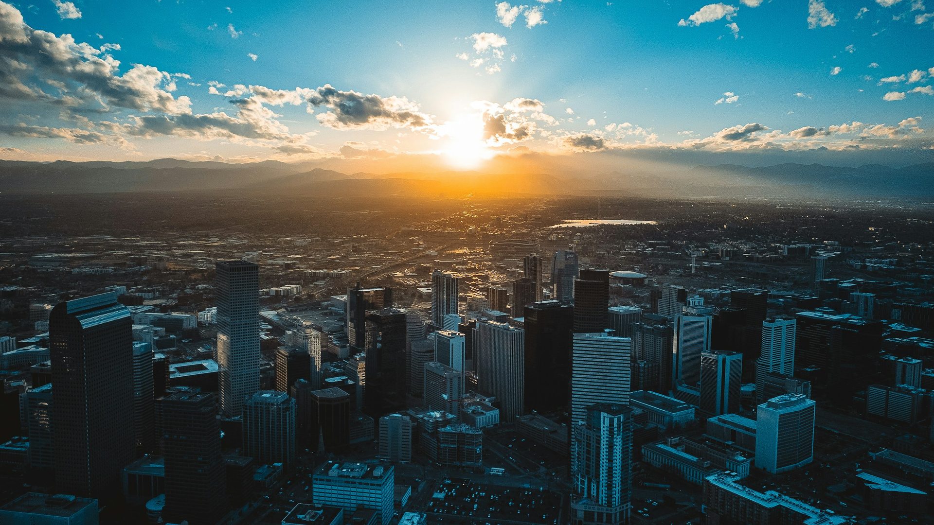 Downtown Denver and the Rocky Mountains at sunset