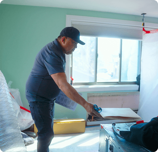 Technician preparing a room for lead abatement