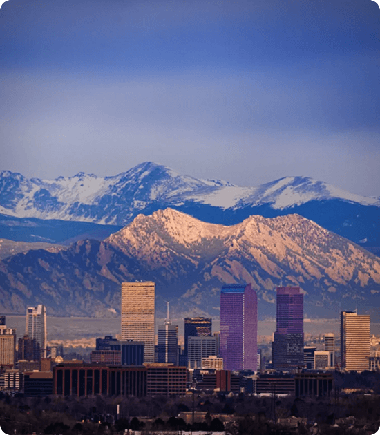 Denver skyline with the snowy Front Range behind downtown