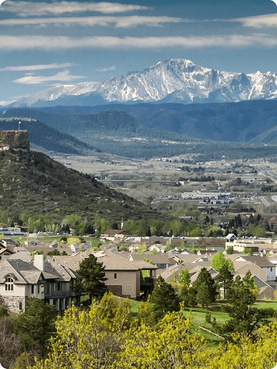 The Castle Rock butte with Pikes Peak in the distance