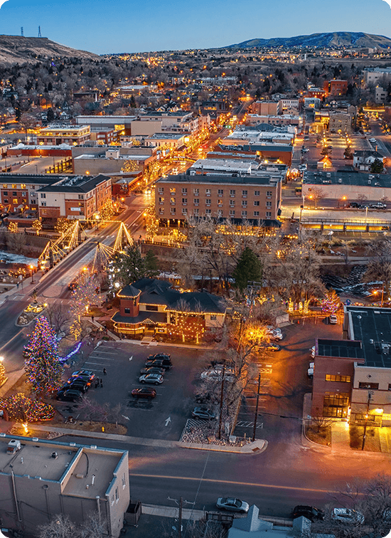 Downtown Golden Colorado at dusk with holiday lights