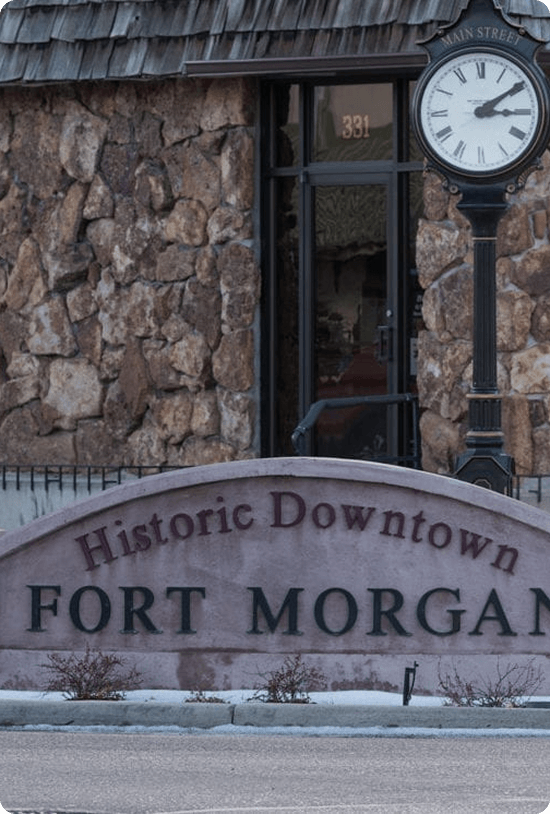 Historic Downtown Fort Morgan sign and Main Street clock